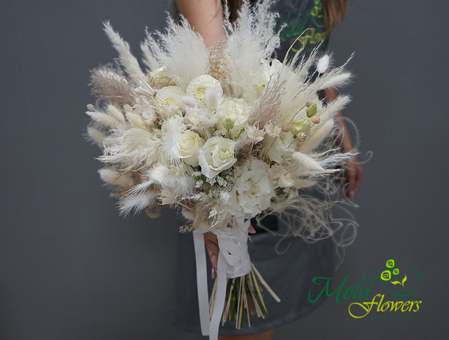 Bridal bouquet of white roses, eustoma, dahlia, and lagurus photo
